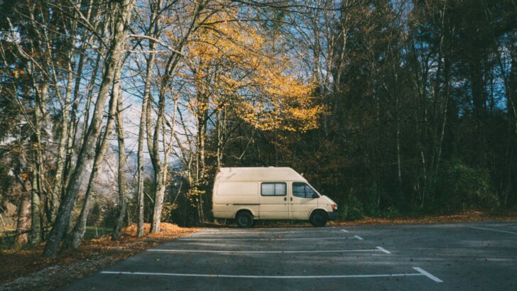 Van conversion parked all alone in a parking lot