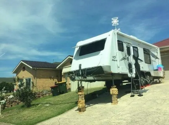 Travel trailer leveled on an unbelievably un-level driveway