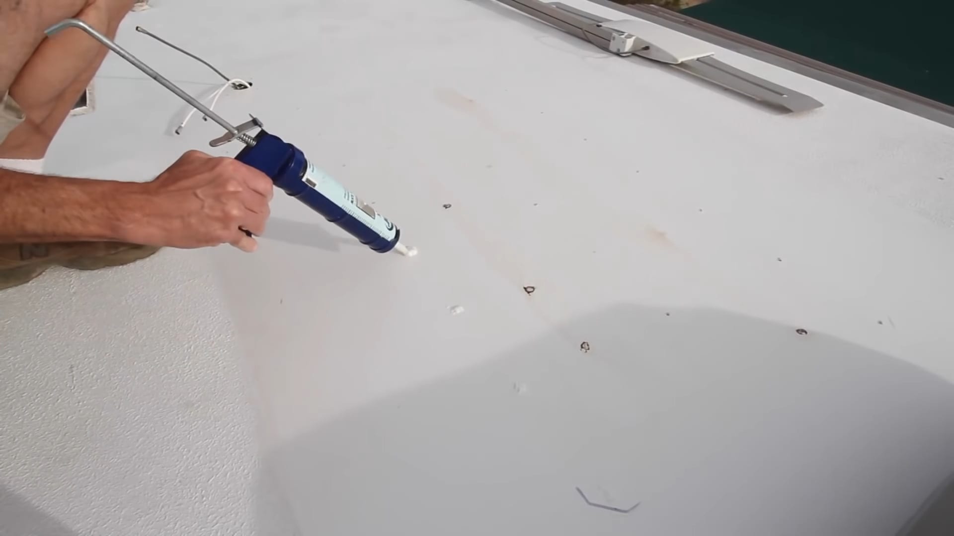 Repairing holes in an RV roof prior to using RV roof coating