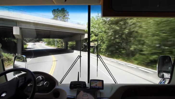 RV driving with overpass ahead