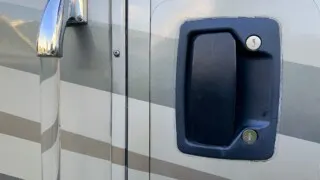 An RV door latch handle from the outside