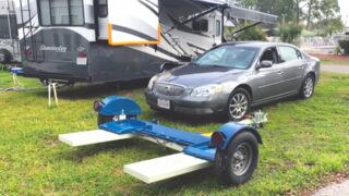 RV Tow Dolly, Front-Wheel-Drive Tow Car, and RV parked in RV Site