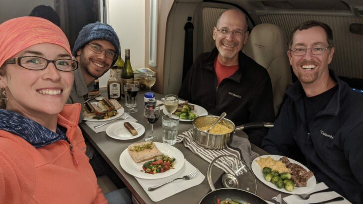 John and Peter with friends using the extended dinette in a Class B Plus RV