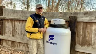 Peter with a large permanently installed ASME propane tank