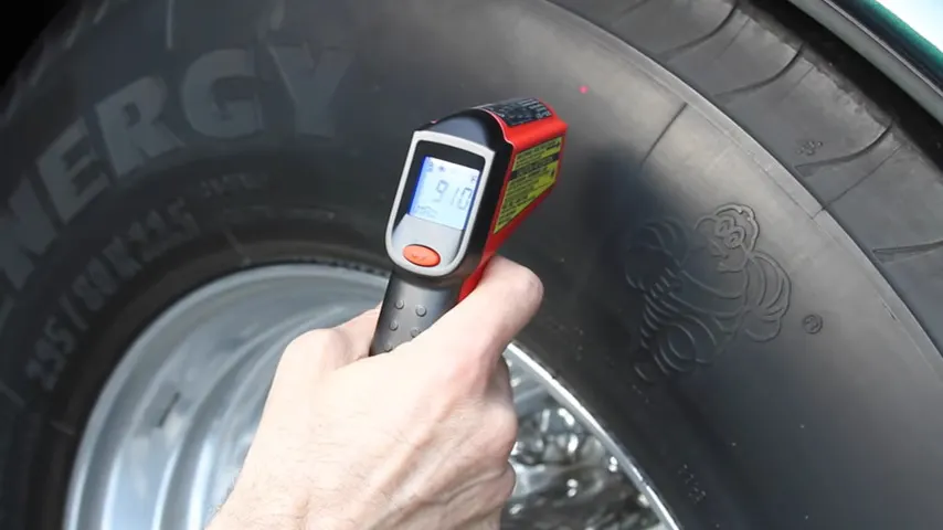 Using an infrared gun to check the temperature of our RV tires.