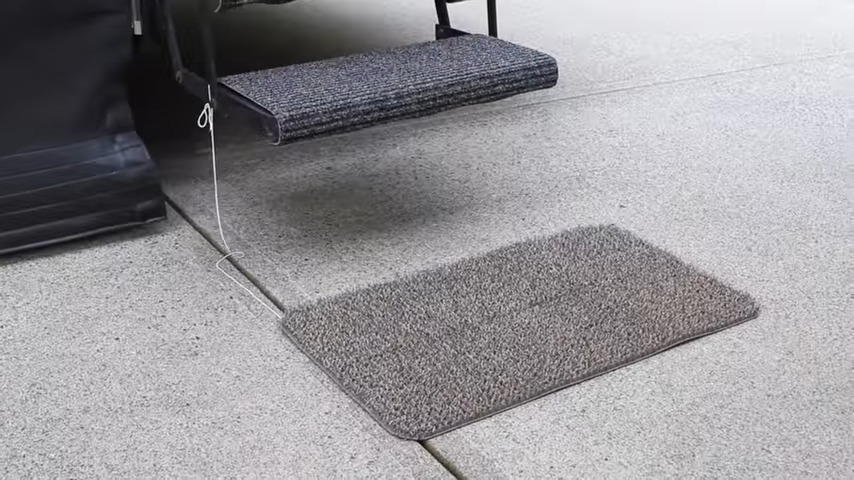 RV tips and tricks include attaching our doormat to our RV step.