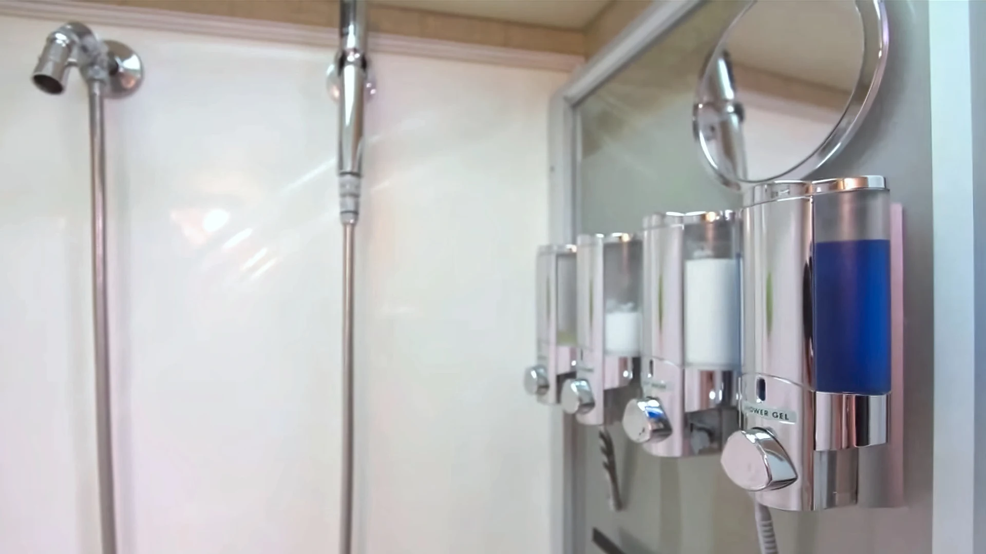 Our RV shower setup with wall-mounted dispensers