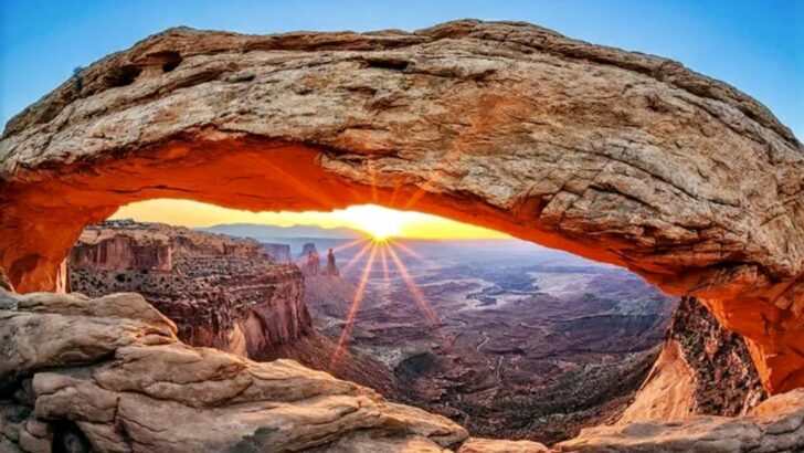 A spectacular sunrise view beneath Mesa Arch in Canyonlands
