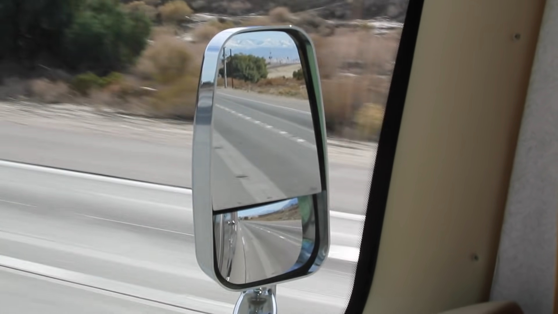 RV mirror adjusted too far out, opening up a dangerous blind spot.