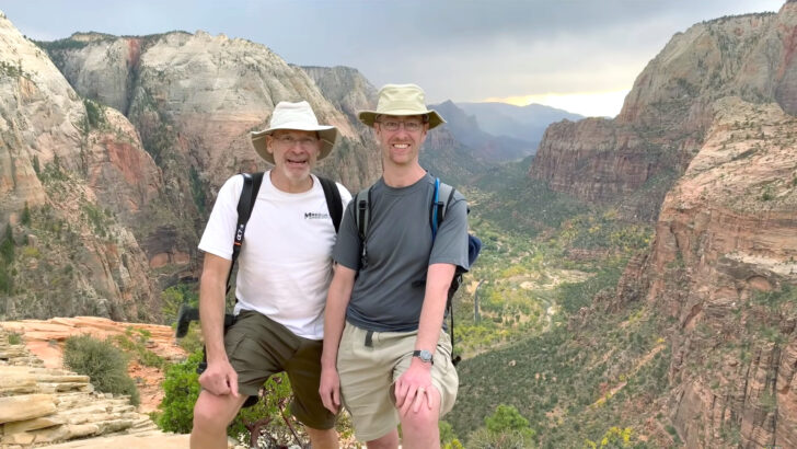 John and Peter at Zion National Park, with the view from Angels Landing spread out behind them