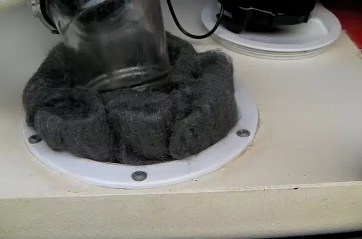 Plugging open areas with steel wool is helpful in keeping mice out of your RV during winter RV camping.