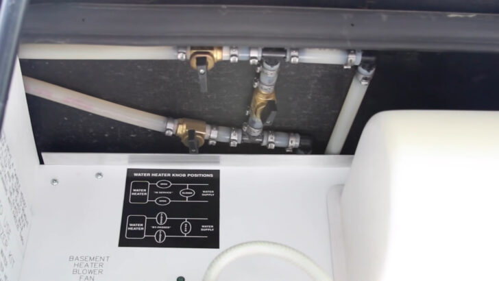 An RV water heater in bypass mode. This is a big factor to consider when learning how to winterize an RV with antifreeze.