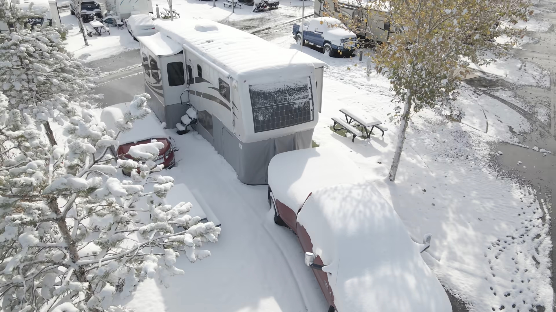 RV parked in cold and snow where RV tank heating pads can be necessary.