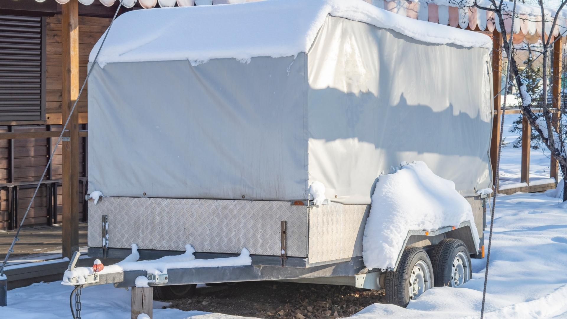 A camper stored in freezing temperatures should be winterized with RV antifreeze.