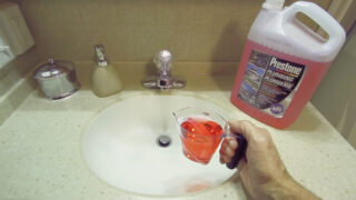 Pouring RV antifreeze down the sink to protect p-trap