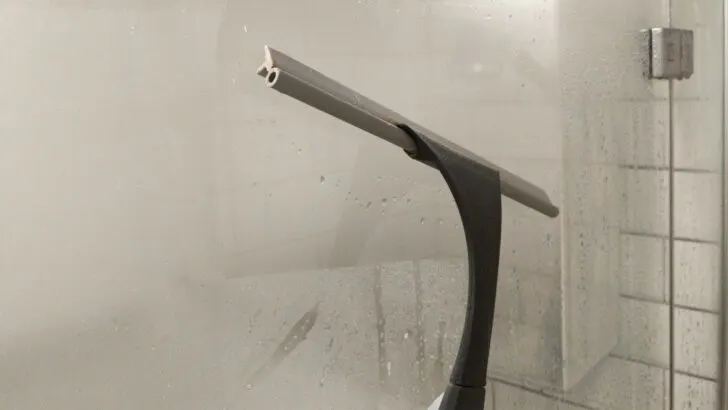 A quick squeegee of the shower walls is important in a wet or dry bath