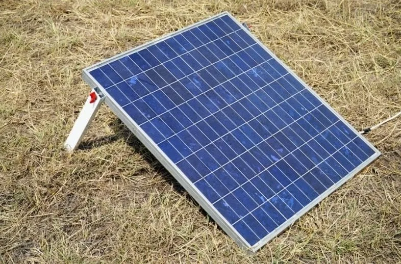 A rigid portable solar panel with support legs