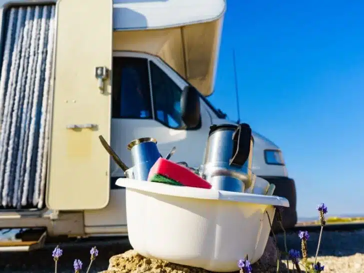 RV outdoor showers provide a great way to wash dishes outside, saving space in the gray tank.