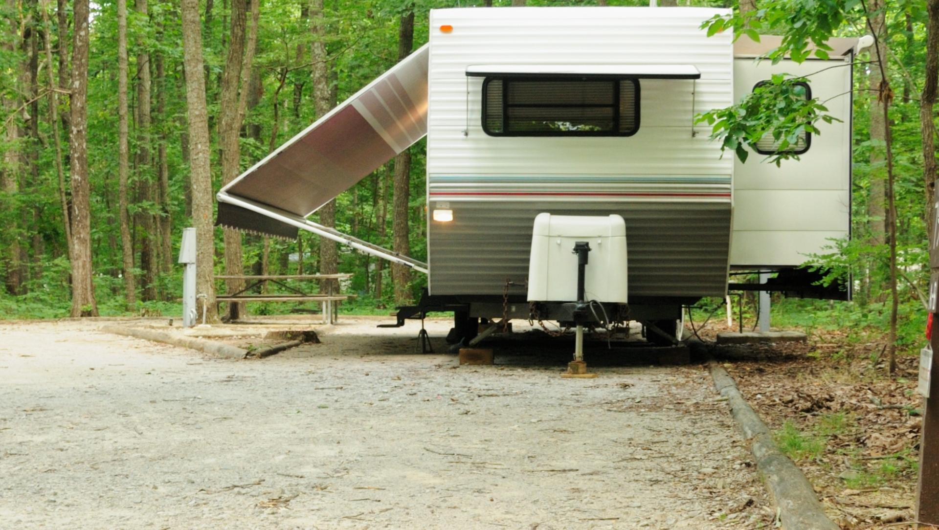 Travel trailer on jack stands at campground