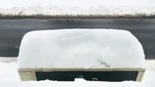 Snow-covered RV AC unit