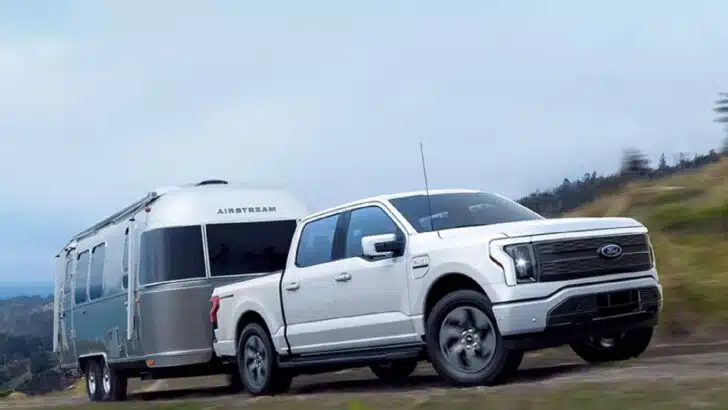 Photo of the Ford F-150 Lightning all-electric pickup truck towing an Airstream.