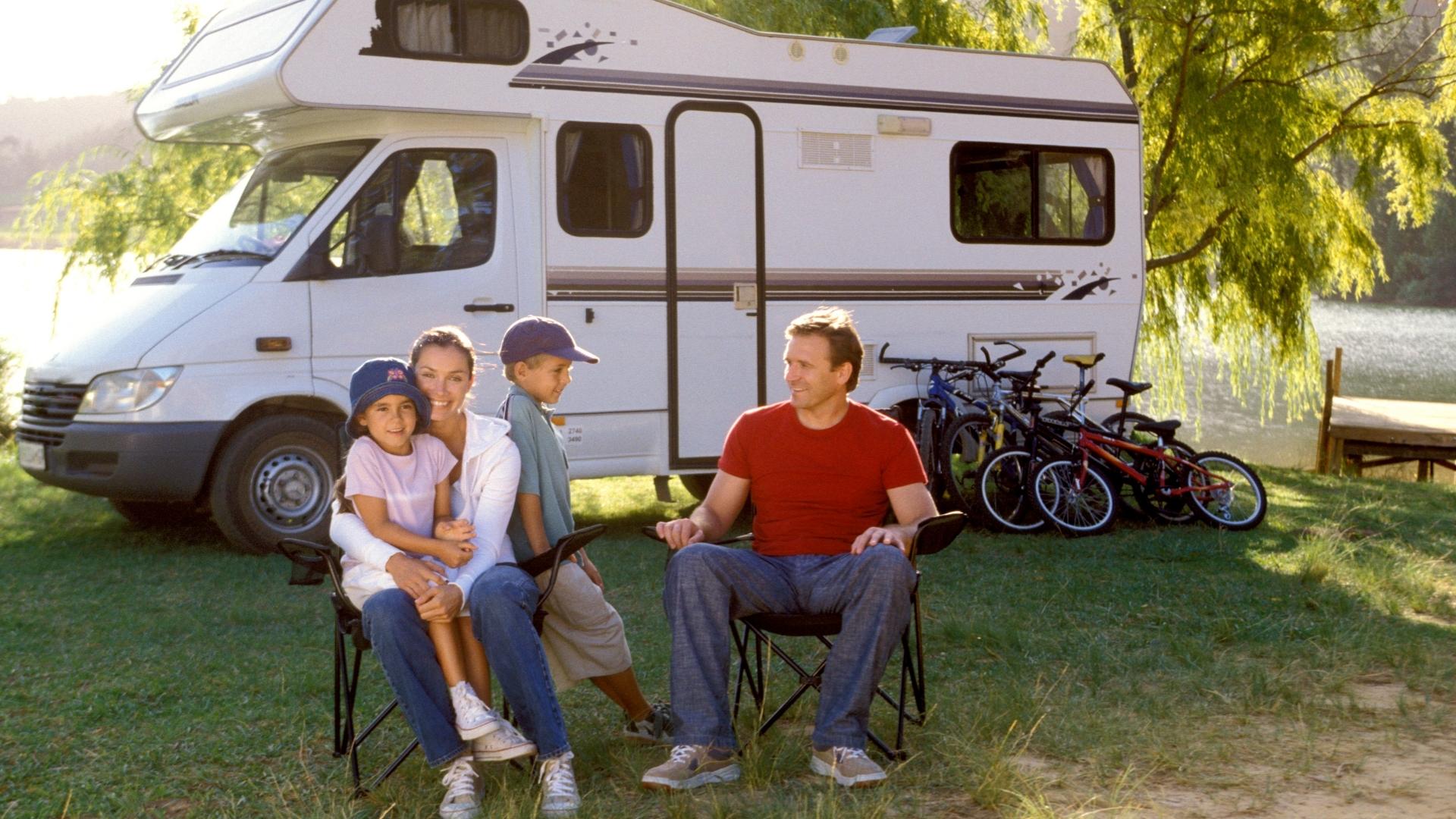 Photo of family with RV and several bicycles