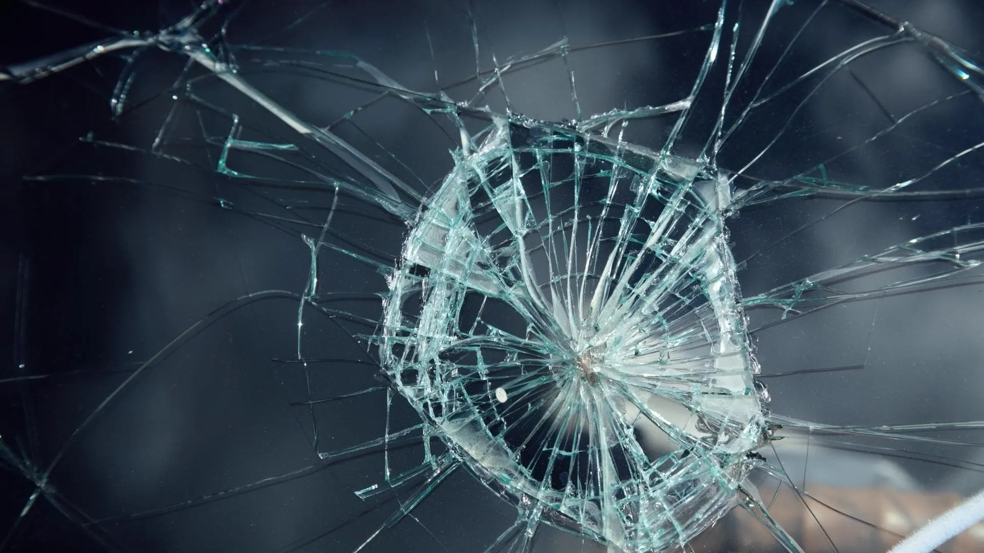 Photo of a badly damaged windshield