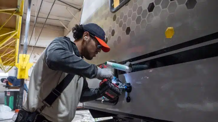 A Forest River technician working on the construction of an R-Pod