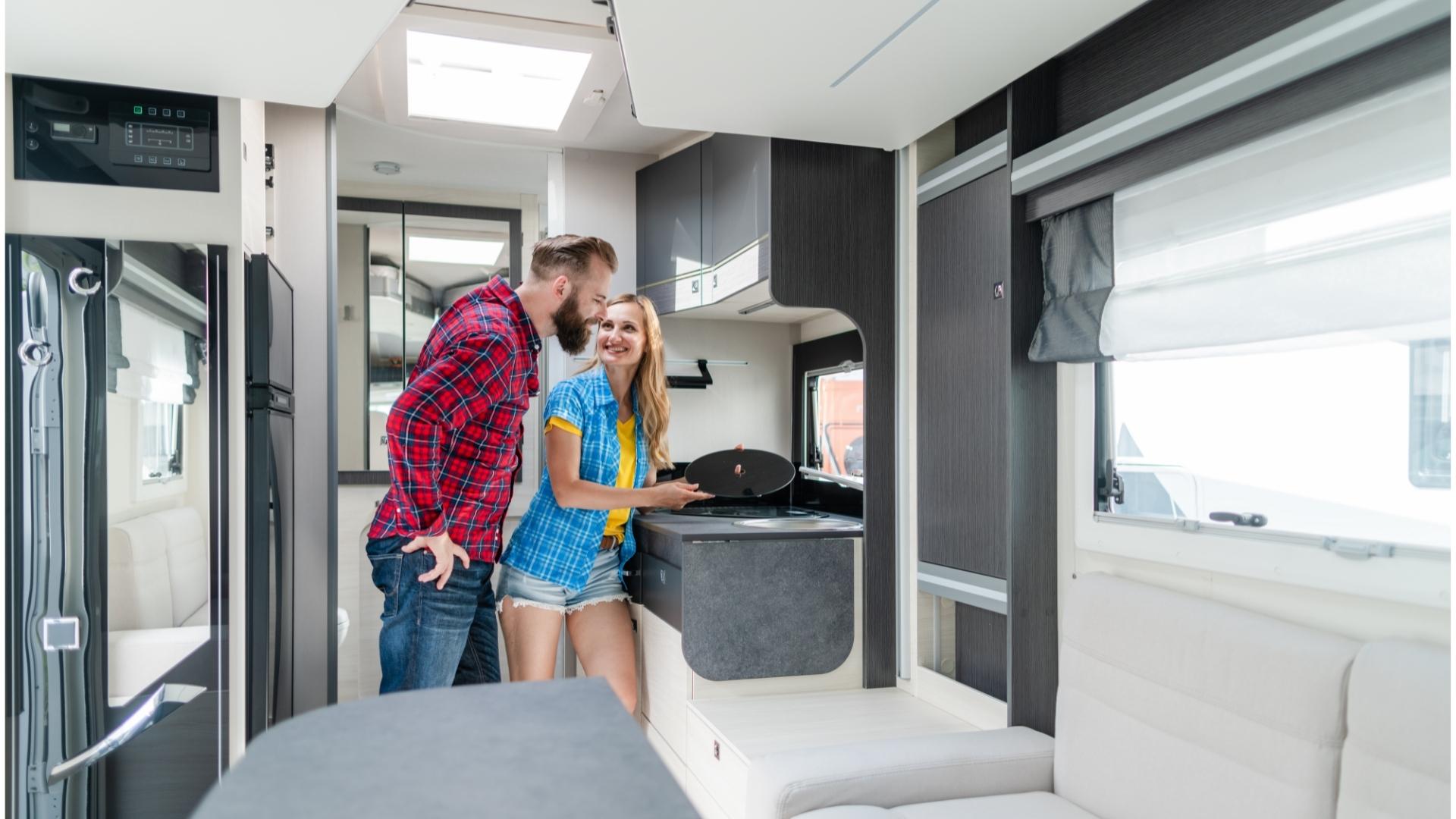 Young couple looking at a new RV