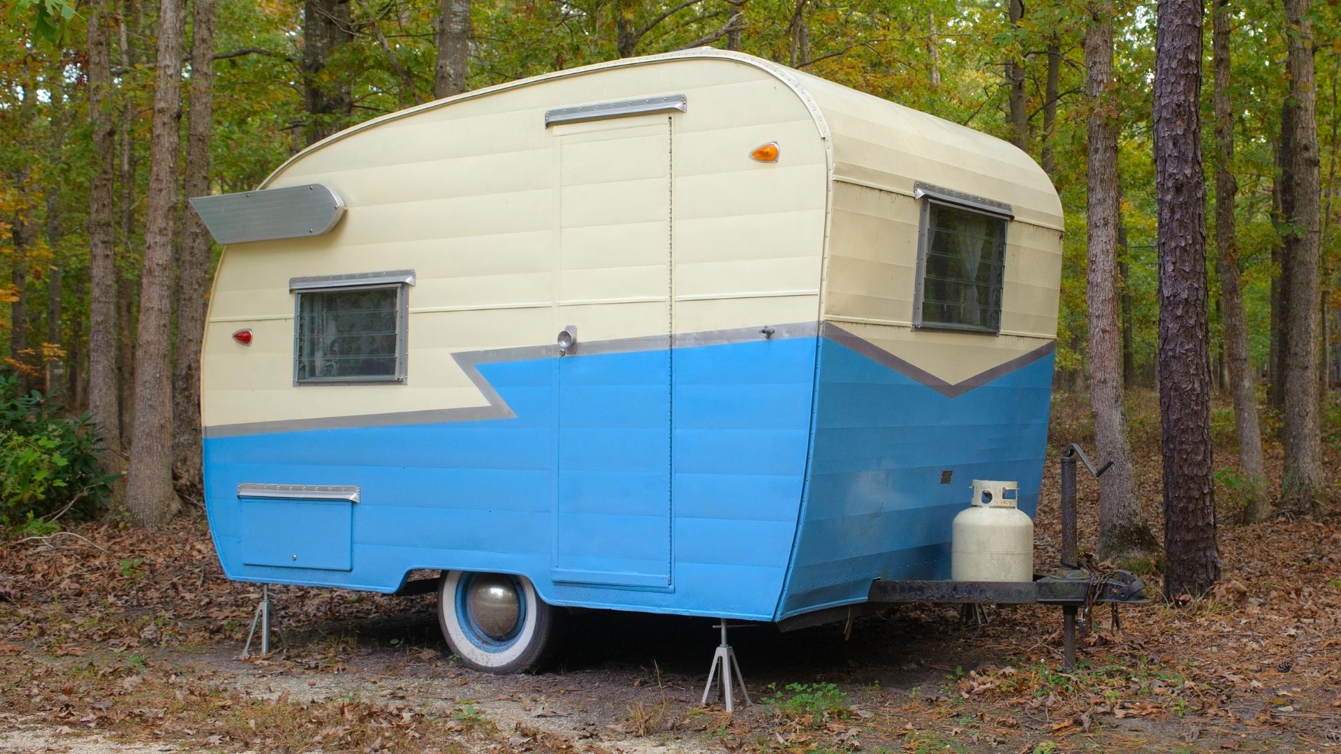 Photo of a small travel trailer with a 20-lb propane tank