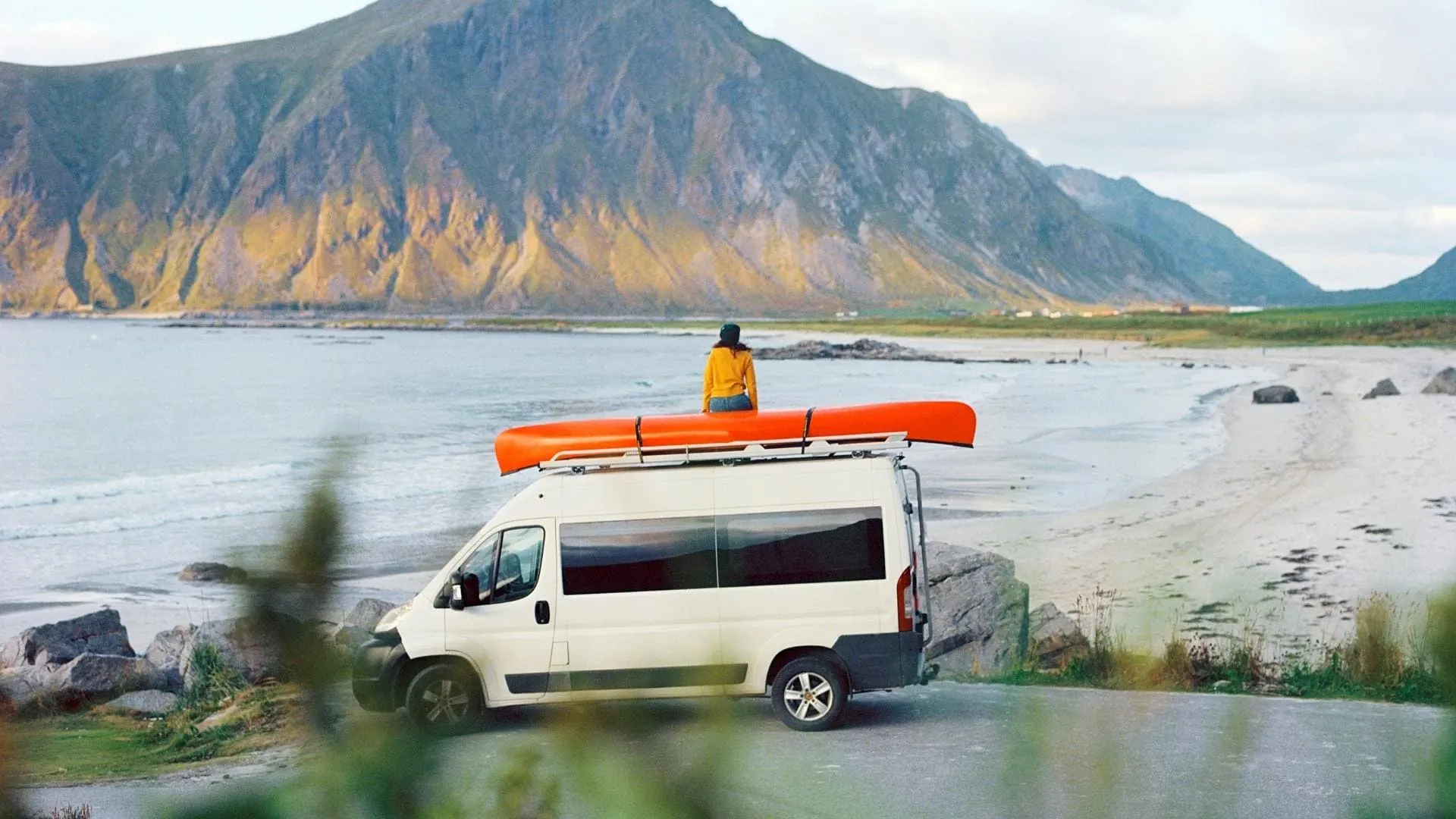 Photo of a Class B RV parked by the water - the ability to park anywhere is among the benefits of smaller RVs
