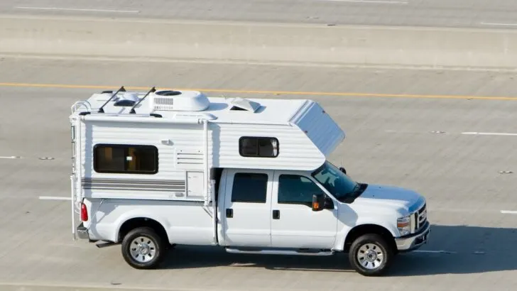 Photo of a truck camper on the highway