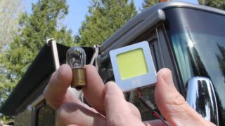 Photo of a traditional RV light bulb and an LED RV light