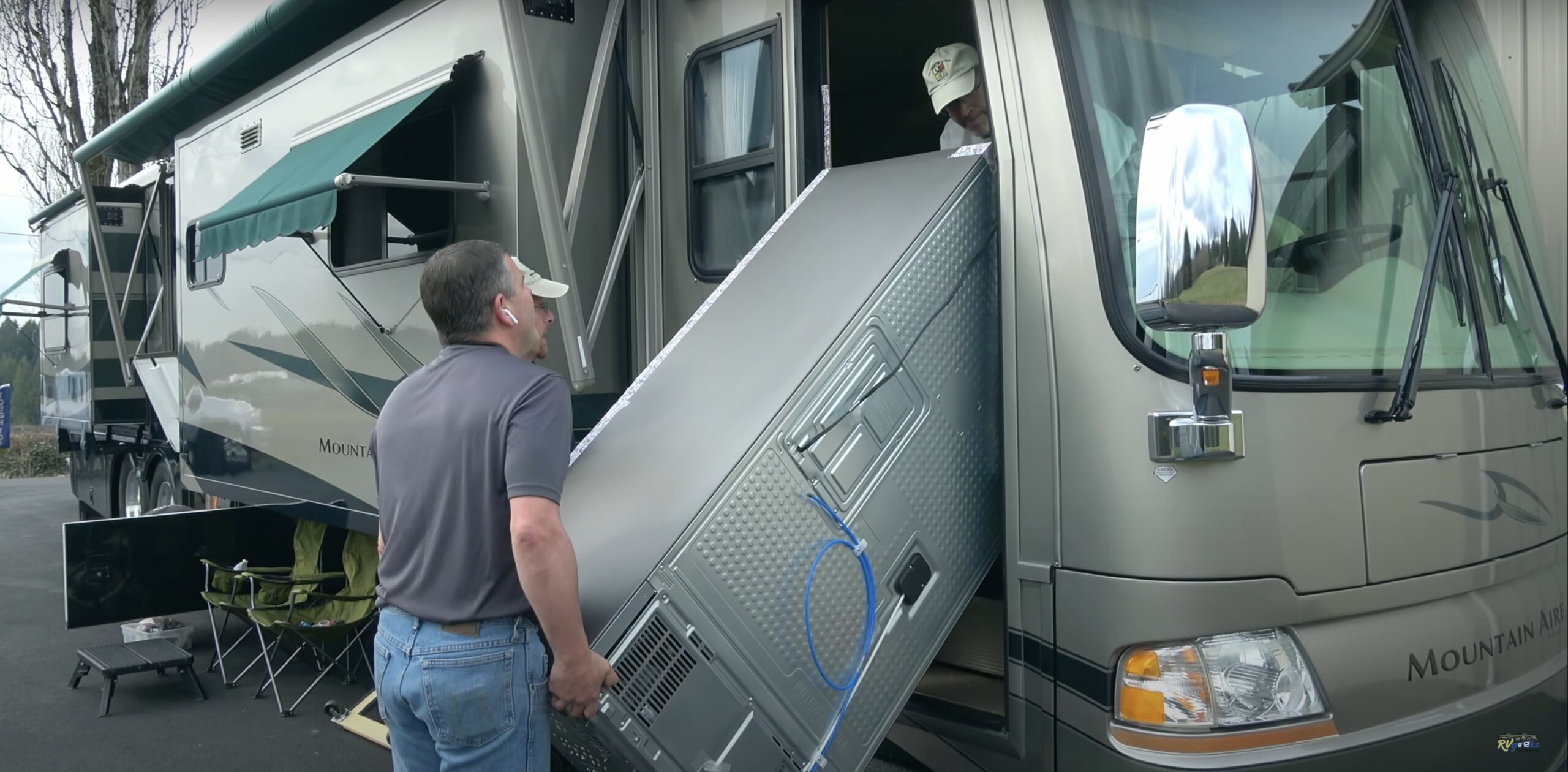 Correct RV tire pressure may change, as in this photo of the RVgeeks moving a new refrigerator through the door of our motorhome