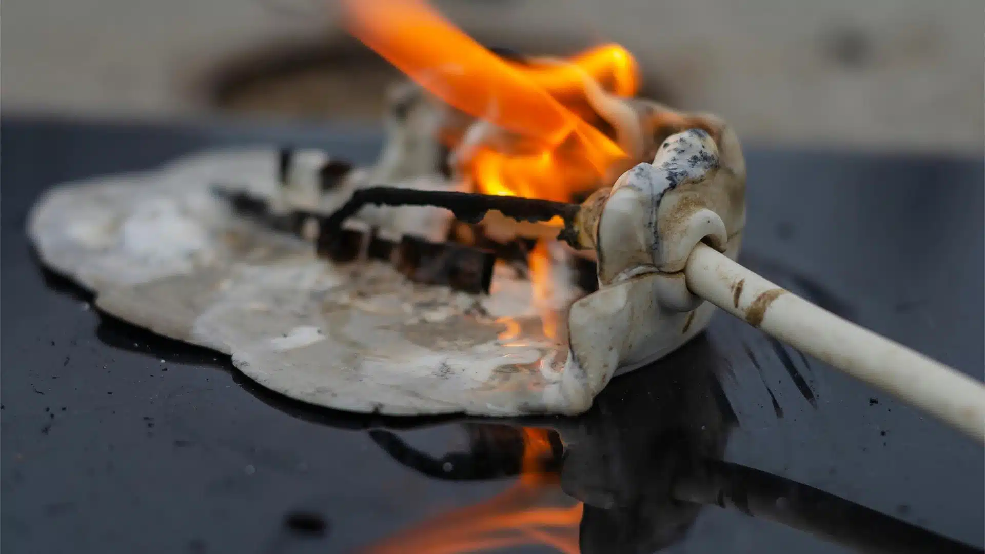 Photo of an electrical fire at the end of a wire