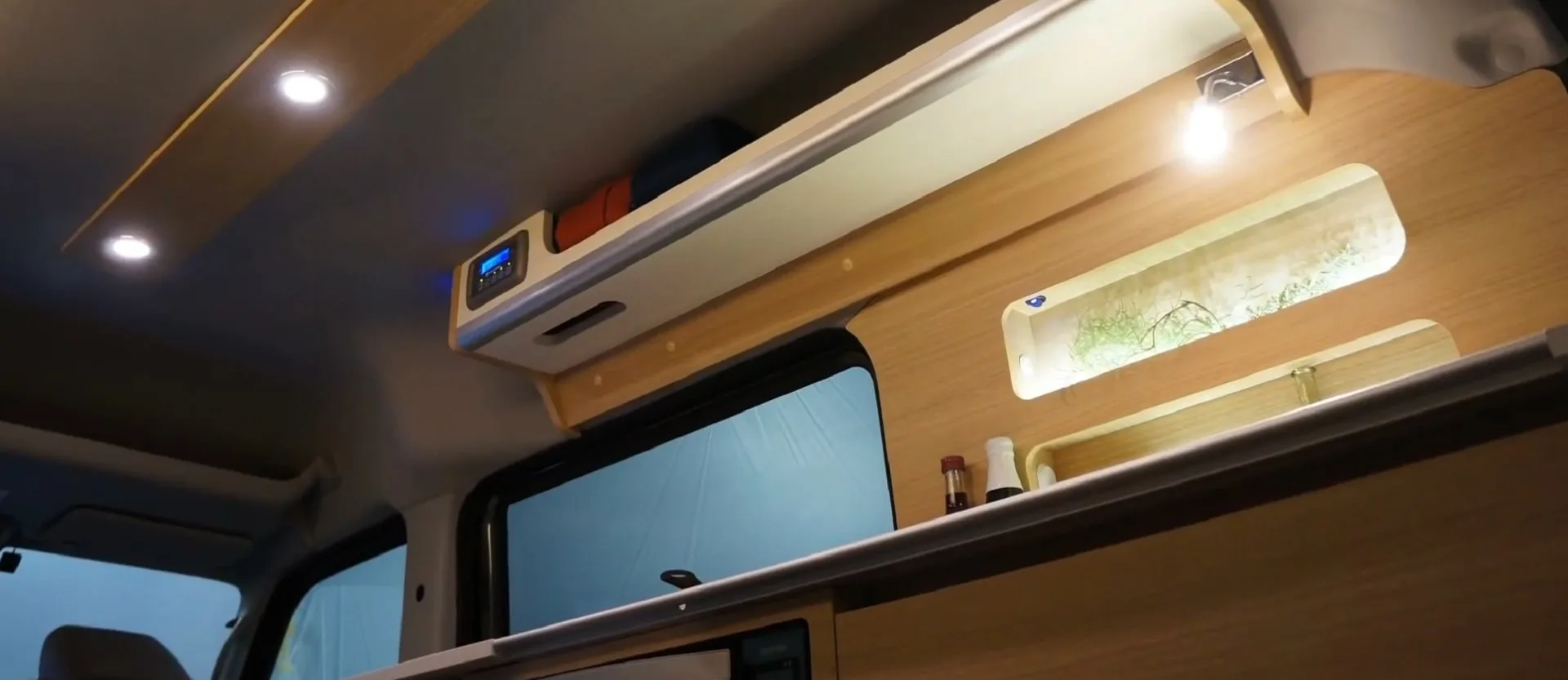 Photo of the lights and electronics in the Miniature Cruise Cozy, one of the smallest camper vans