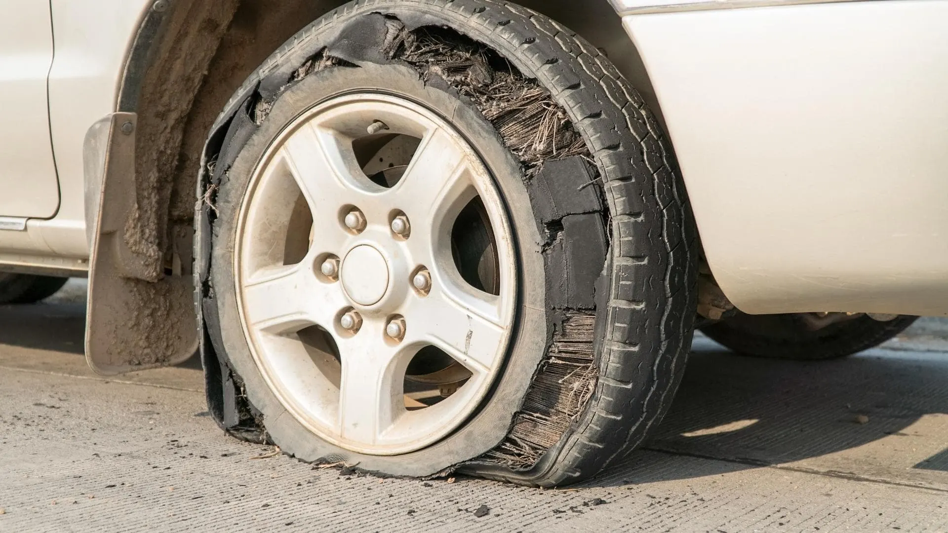 Incorrect rv tire pressure can cause a blowout, as shown in this photos of a damaged tire.