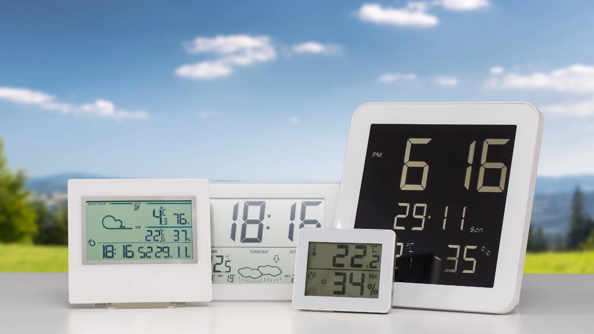 Photo of four different weather station screens