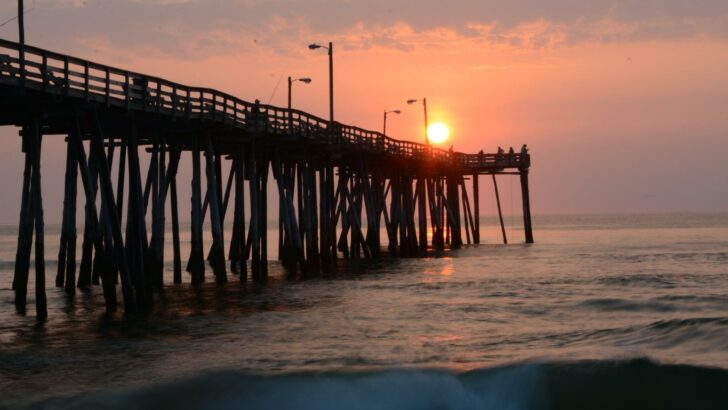 Photo of a wooden pier at sunset in the family vacation destination of the Outer Banks of North Carolina