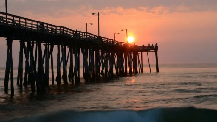 Photo of a wooden pier at sunset in the family vacation destination of the Outer Banks of North Carolina