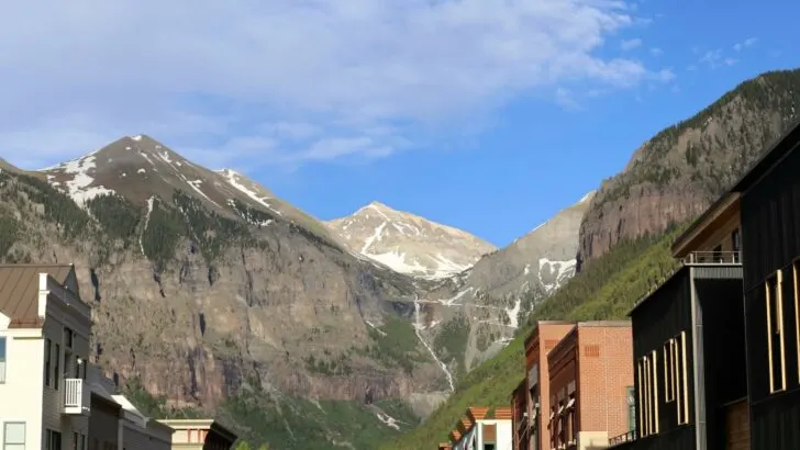 Photo of downtown Telluride, Colorado, surrounded by mountain ranges