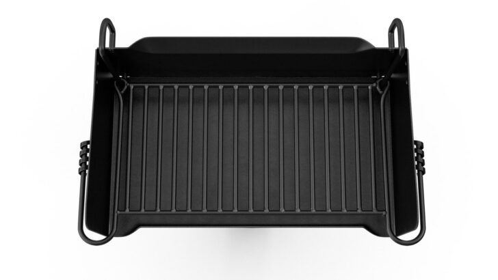 A portable grill folded for compact storage