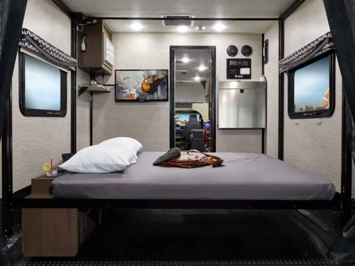 A drop-down bunk in the garage of a Thor Outlaw Class C toy hauler motorhome