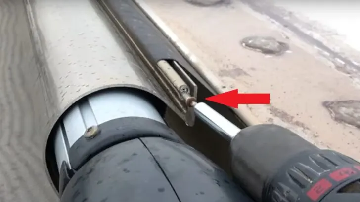 One of two set screws on each end of the awning side