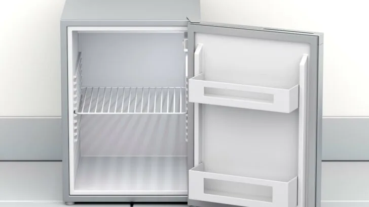 A small, empty fridge the size of a small RV fridge