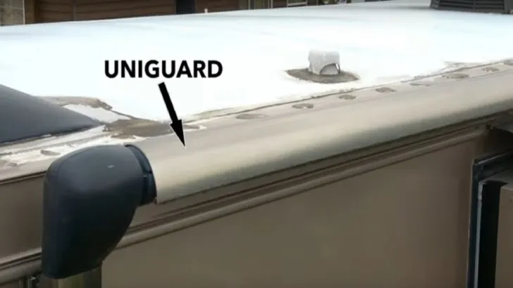 Photo of a Uniguard, a metal piece covering a retracted Carefree of Colorado powered awning. Carefree awning fabric replacement explained.