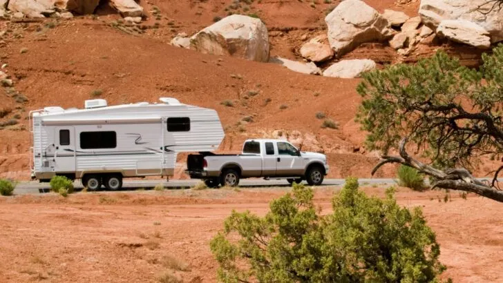 A 5th wheel being towed by a pickup truck