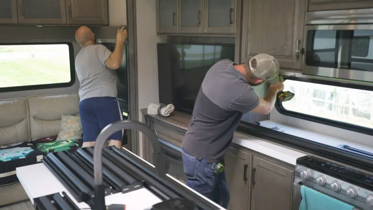 RV replacement blinds being installed by Bradd & Hall's expert technicians.