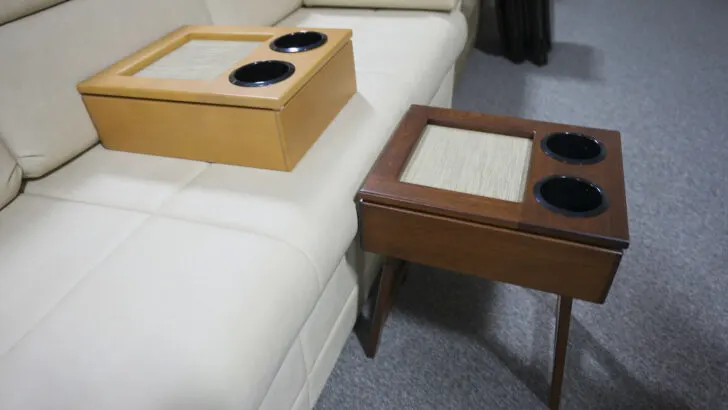 Bradd & Hall's Cubby Consoles shown standing on legs and set on a sofa