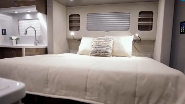 A Murphy bed couch in bed mode in the Airstream Atlas